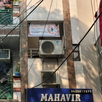 A building with a sign reading 'Action Detective' on it.