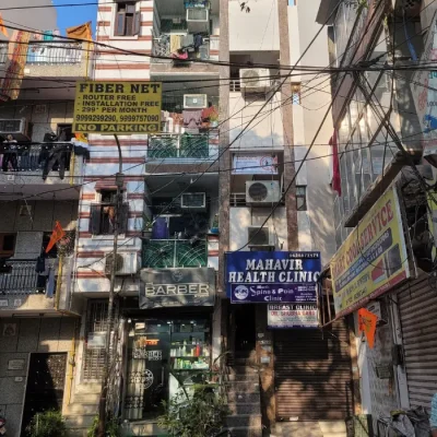 A building with a sign reading 'Action Detective' on it.