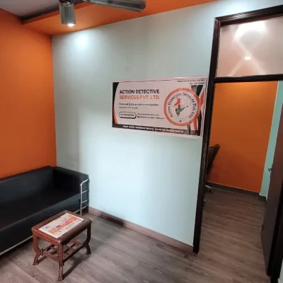 Action Detective Rohini waiting room with a banner and a comfortable couch.