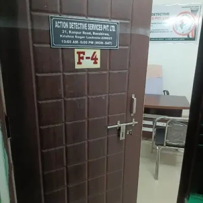 "Action Detective Services Pvt. Ltd." text a brown door nameplate.