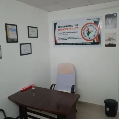 Private Detective Agency In Gorakhpur - Action Detective Office with Banner, Table, Awards, Certification with chair visible.