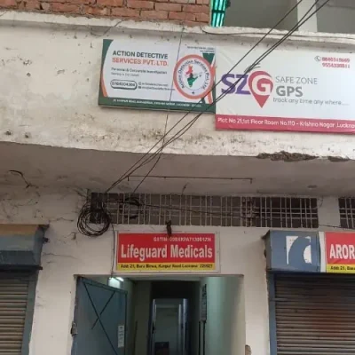 Action Detective Lucknow Office Exterior Photo, Building with Banner Visible.